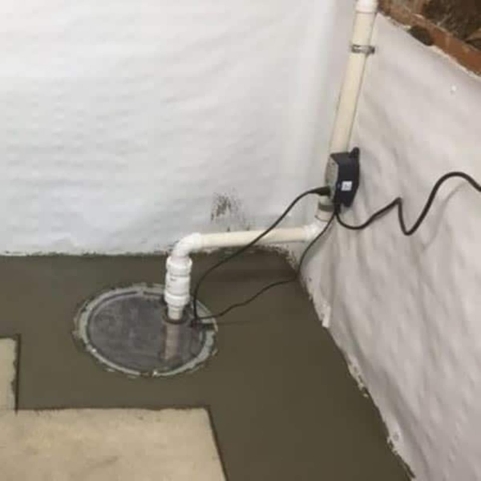 Sump pump pit installed in a basement floor