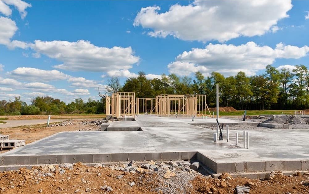 Photo comparing a slab foundation to a raised crawl space foundation