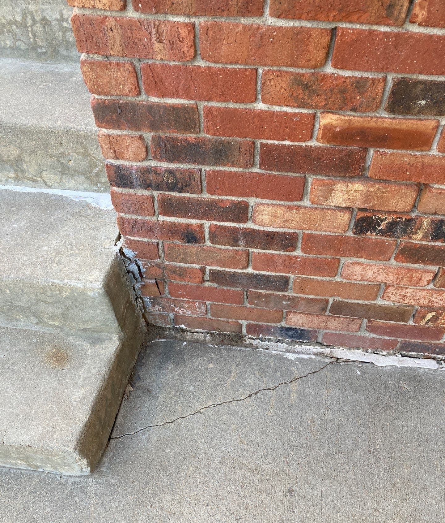Underlying cause of cracks in floor tiles and grout in Midwest homes