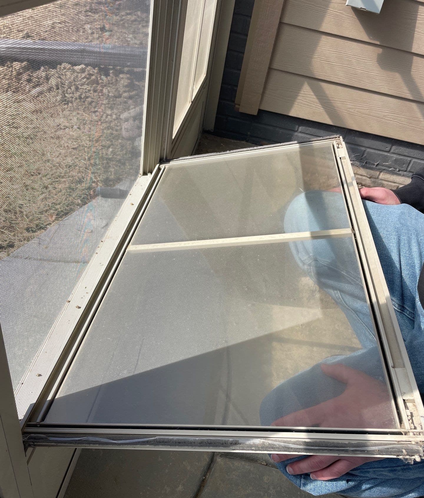 Epp Foundation Repair technician inspecting a misaligned door frame causing an air gap in Lincoln, NE.
