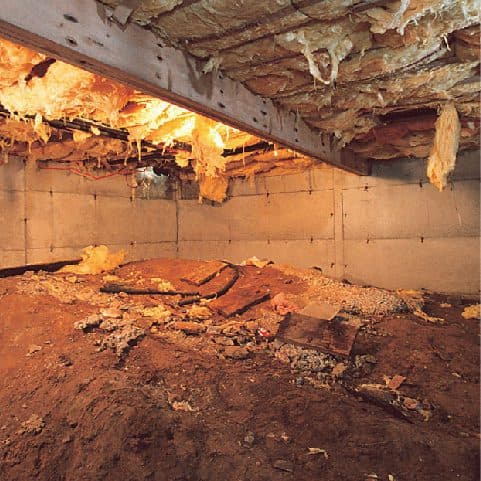 Epp Foundation Repair inspecting a crawl space with severely deteriorating insulation, exposed dirt, and debris, indicating m