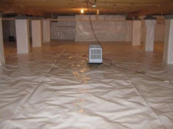 Epp Foundation Repair installing a vapor barrier and dehumidifier in a crawl space.