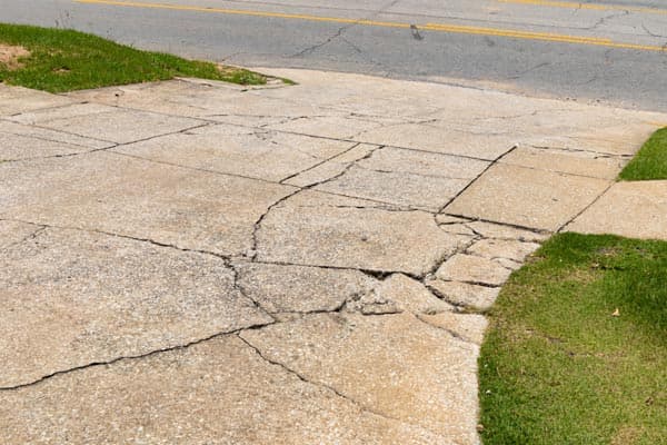 Early warning signs of sinking driveways diagnosed and lifted back to grade on a Midwest home