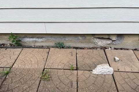 Underlying cause of pitting, flaking, and staining on exterior concrete in Midwest homes
