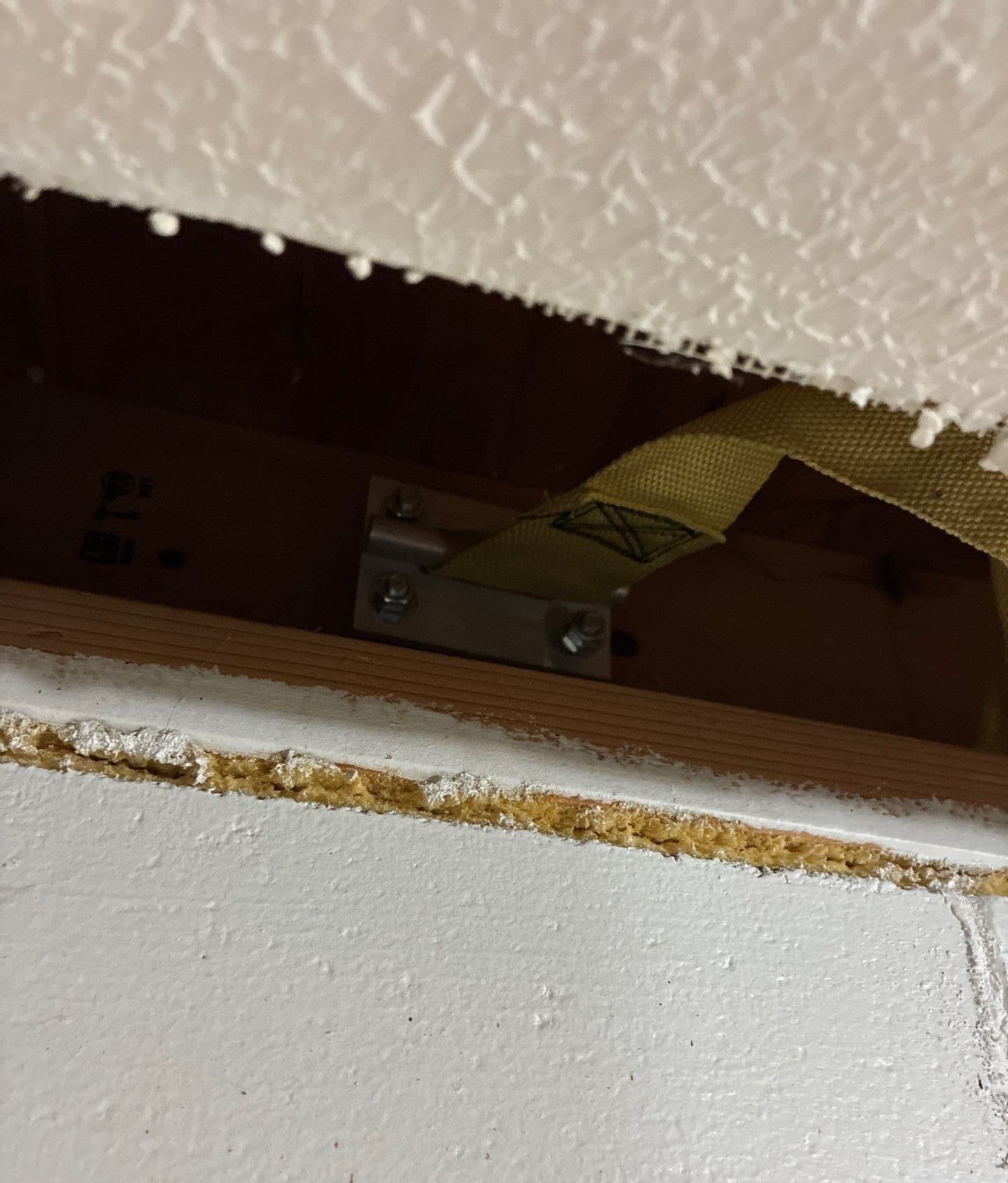 Epp Foundation Repair installing wall anchors to stabilize a bowing basement wall in Kearney, Nebraska.