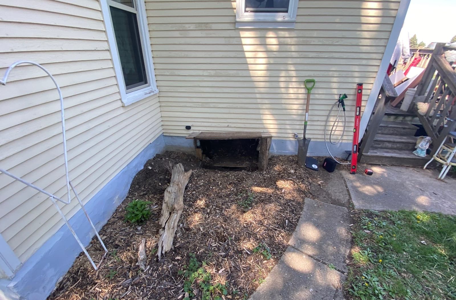 Epp Foundation Repair preparing for crawl space access well installation and drainage work in Macedonia, IA.