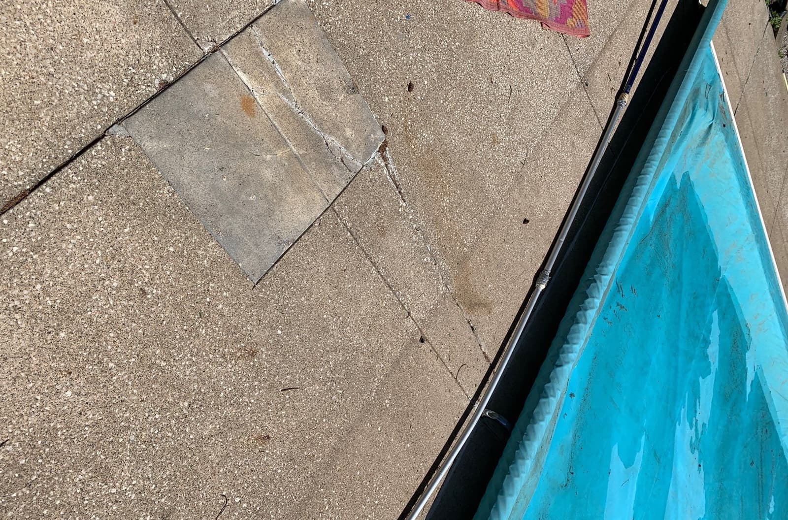 Underlying cause of pool deck settling and tilting around the pool in Midwest homes