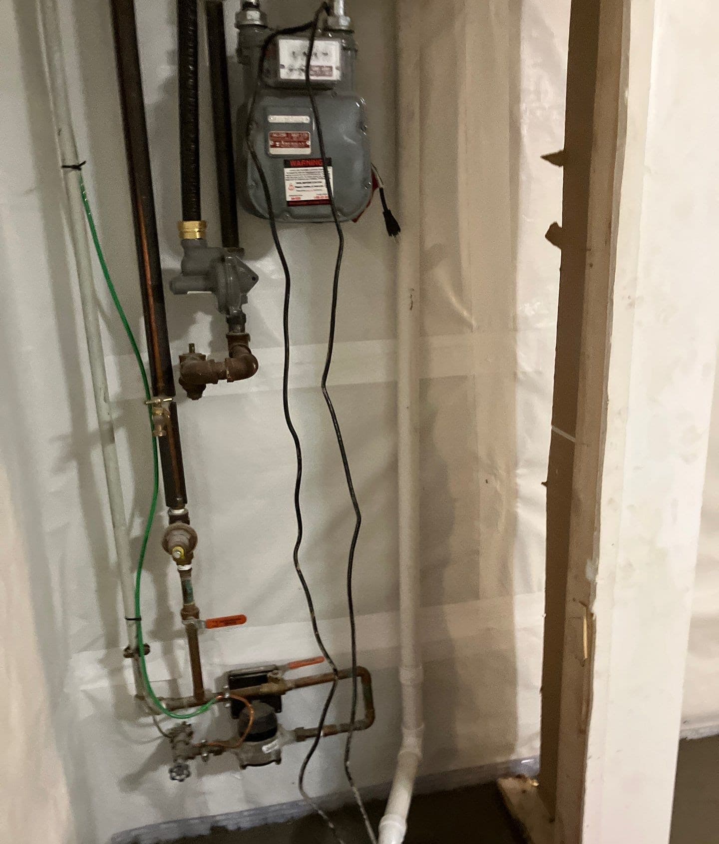 Epp Foundation Repair installing a sump pump and vapor barrier for basement waterproofing in Omaha, Nebraska.