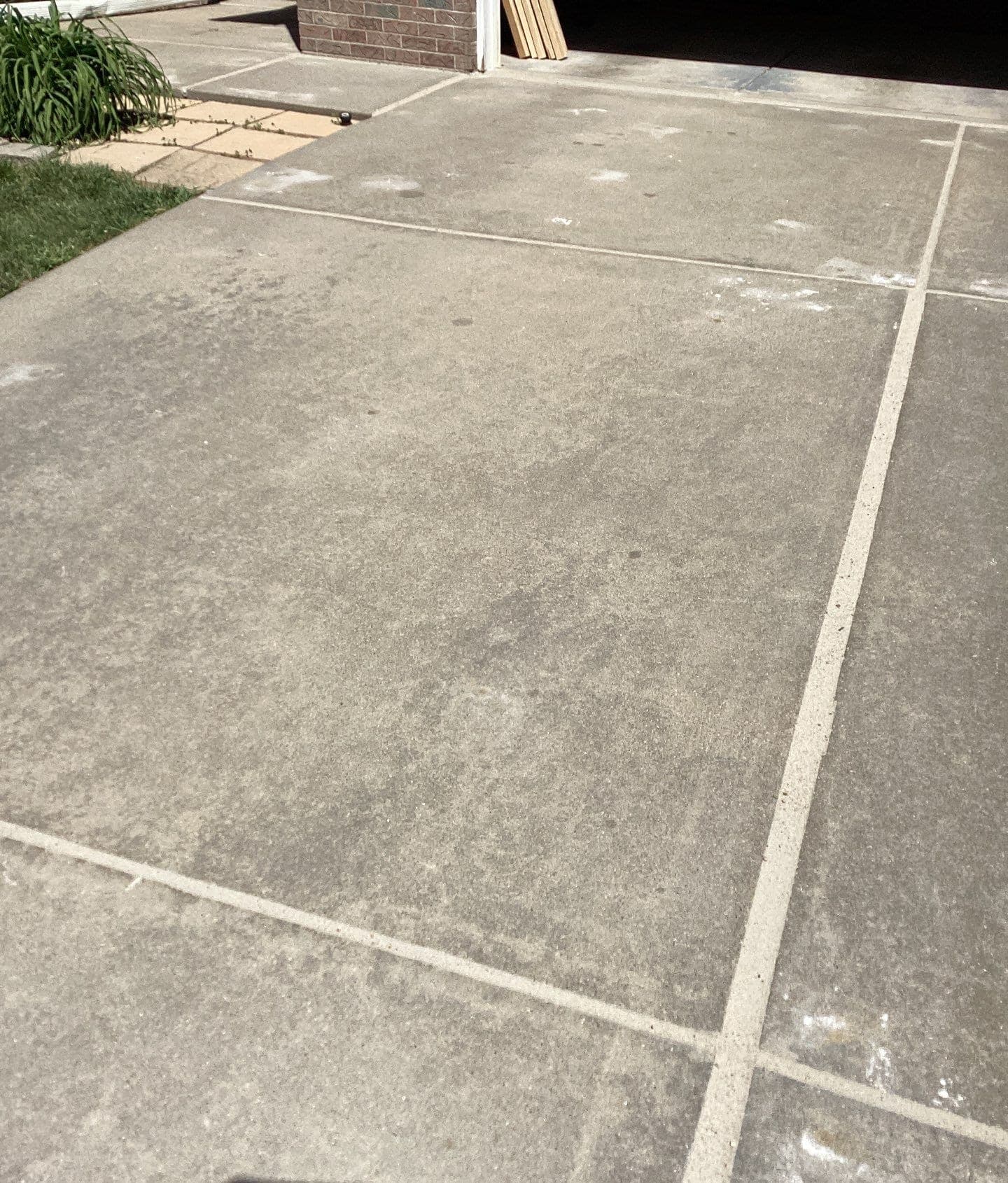 Epp Foundation Repair sealing concrete joints and filling voids on a driveway in Lincoln, NE.