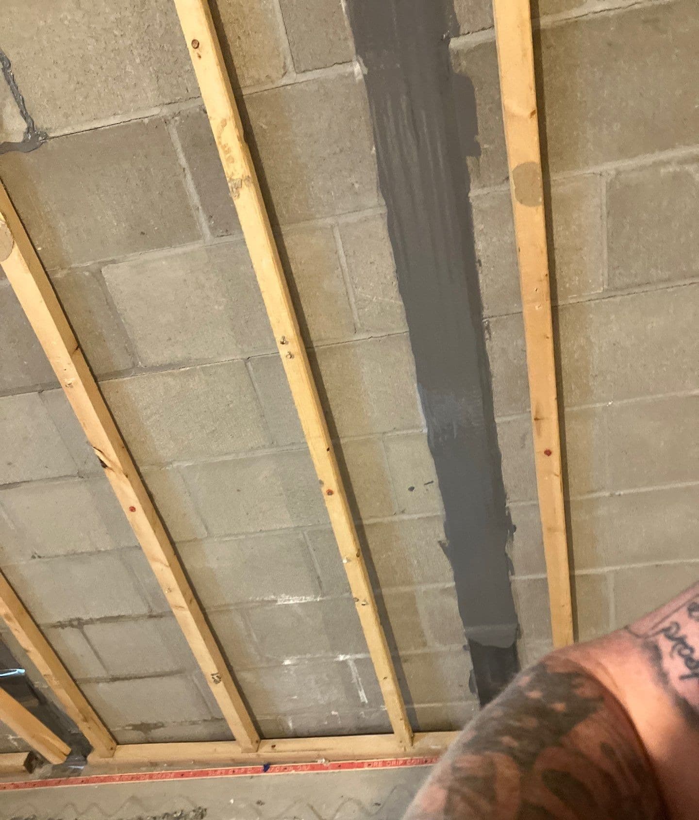 Epp Foundation Repair applying a vertical crack repair to a concrete block basement wall in Lincoln, NE.