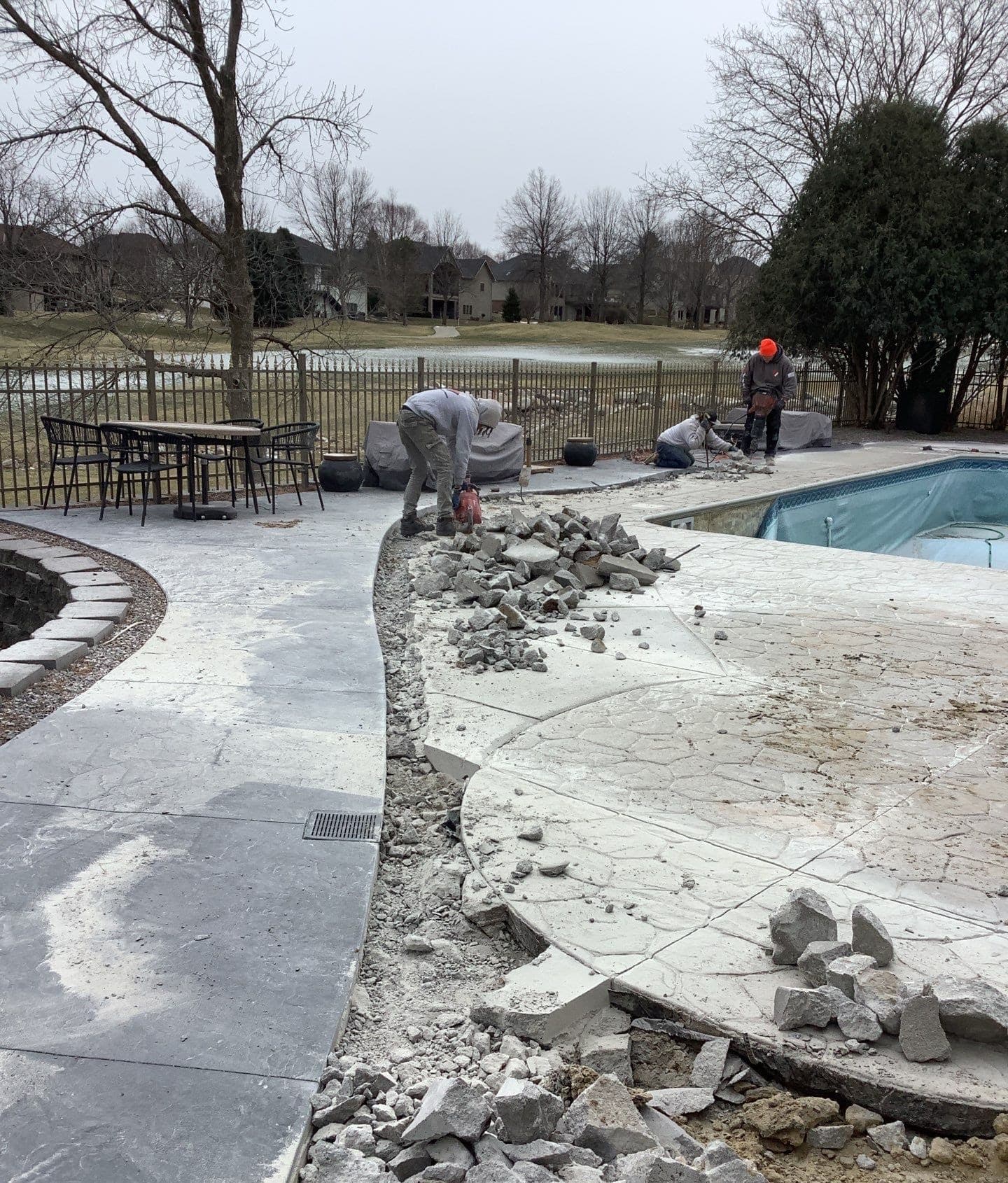 Early warning signs of pool deck settling and tilting around the pool on a Midwest home