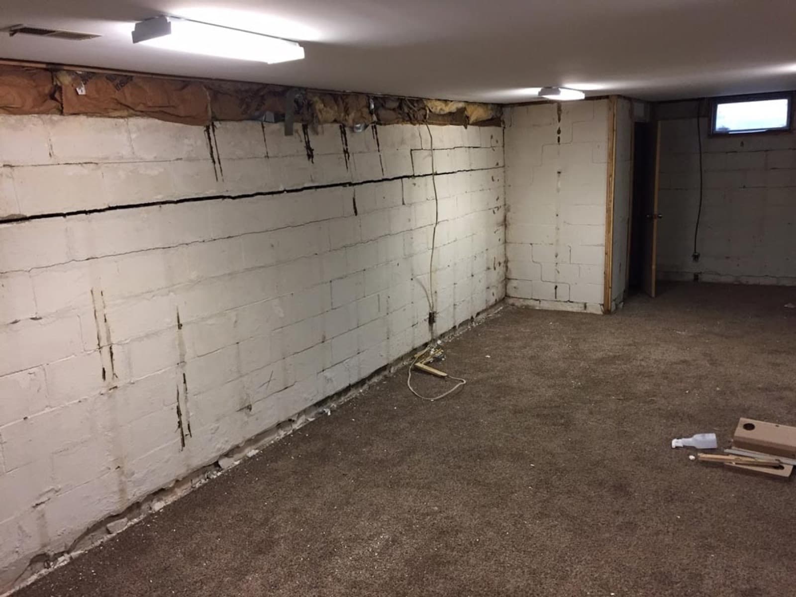 Bowing basement wall with visible horizontal cracking