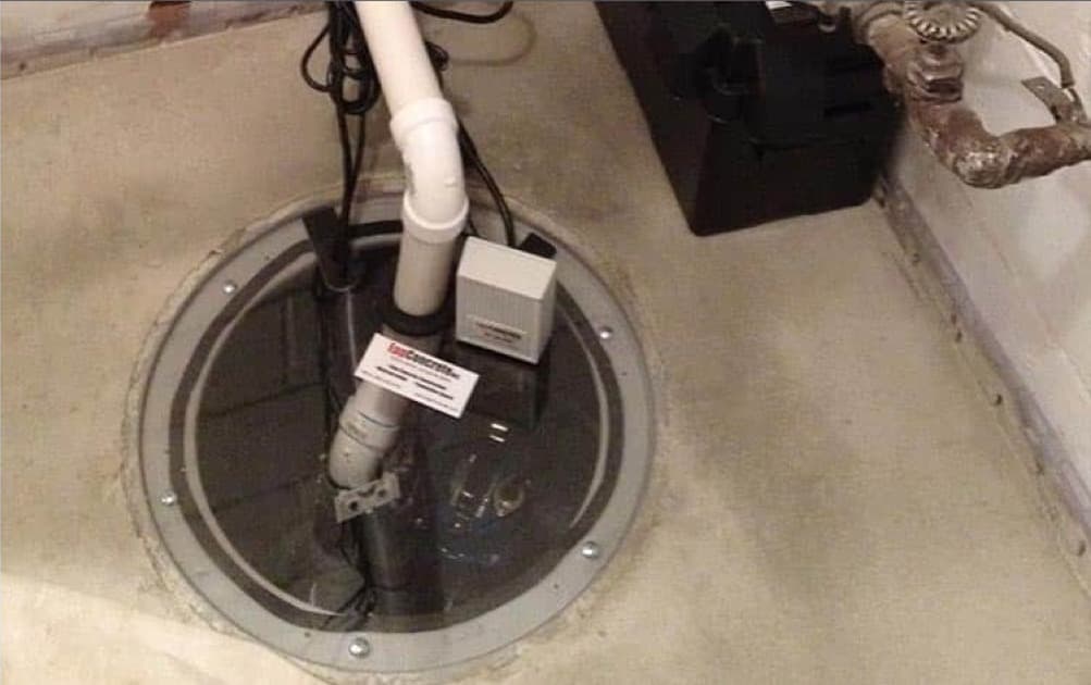 Sump pump installed in a basement sump pit
