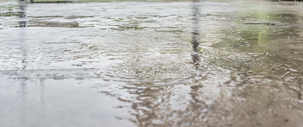 Install drainage around your home’s patio to prevent standing water and protect your outdoor space from damage with our step-by-step guide.